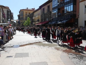 The 12 neighbourhoods parade their 'calderas' through the city in traditional dress.